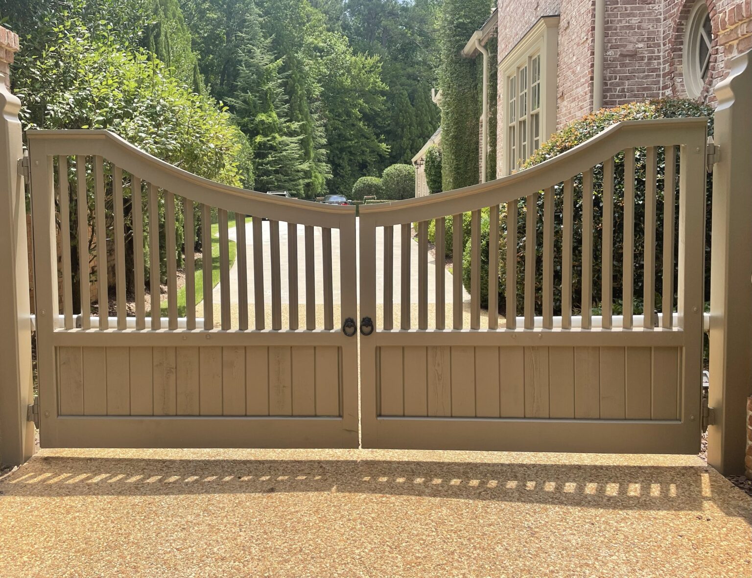 Custom wooden driveway gate with FAAC gate operators in Atlanta, installed by Peachtree Fence & Gates