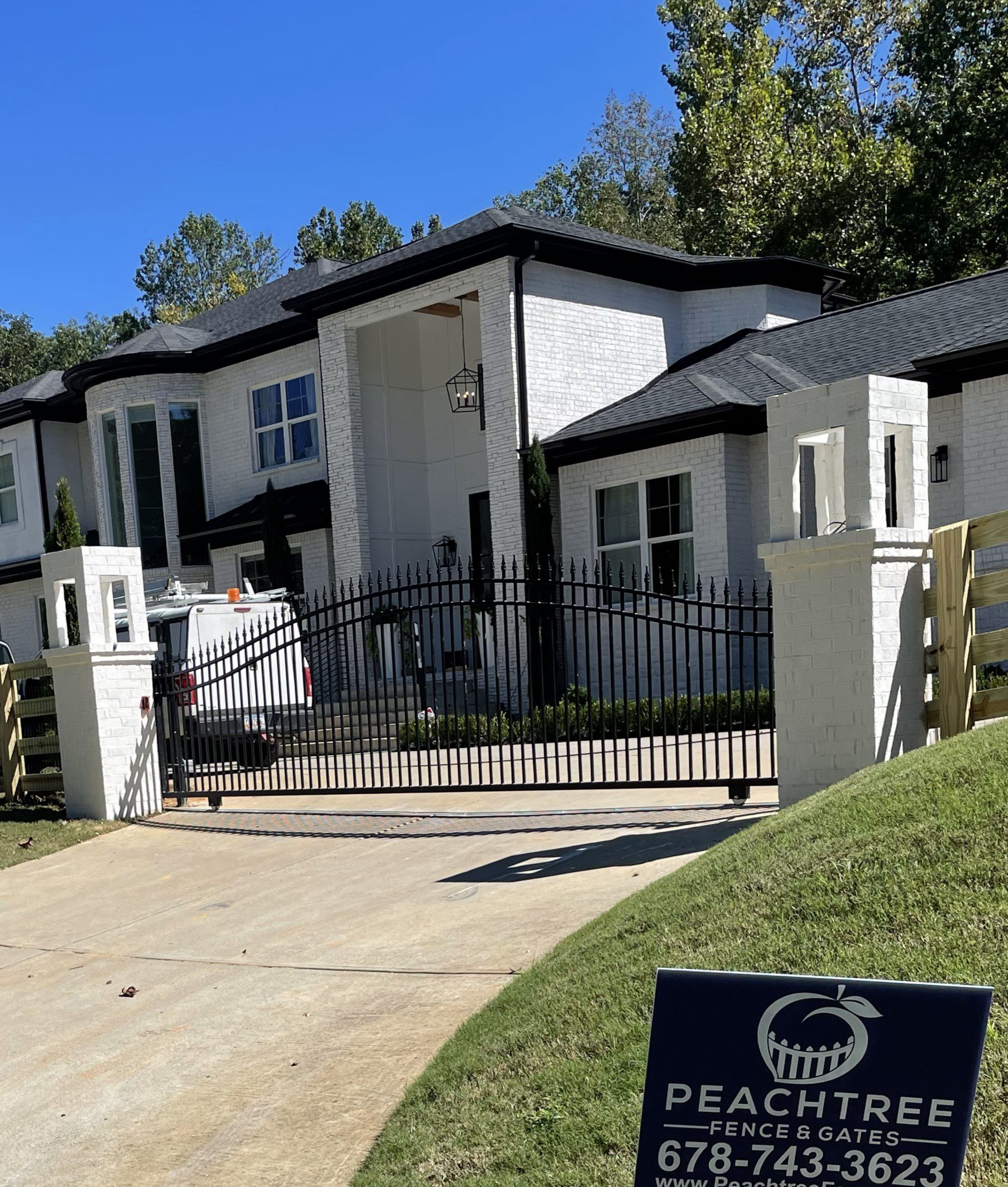 Custom slide gate with automatic opener, installed by Peachtree Fence & Gates