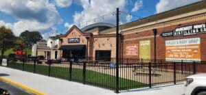 Commercial steel fence around a patio of a distillery & restaurant in Dawsonville, Ga., installed by Peachtree Fence & Gates