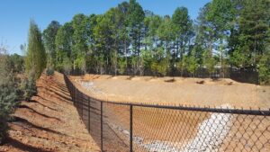Chain link fence around a detention pond in Atlanta, Ga., installed by Peachtree Fence & Gates
