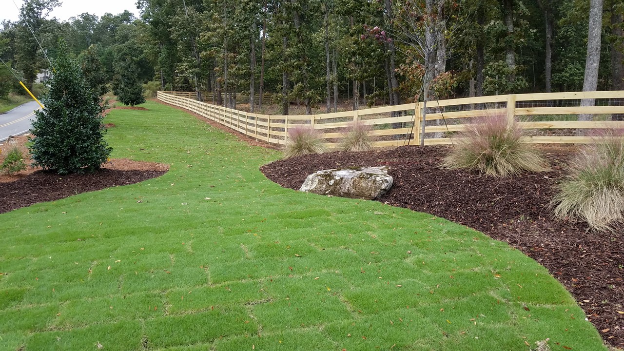 4-rail farm fence installed across the front of a large estate property in North Georgia, installed by Peachtree Fence & gates